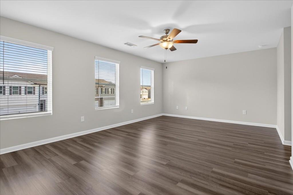 107 Brexley Drive Calhoun, GA 30701 - Photo 23 of 36 a view of an empty room with wooden floor and a window