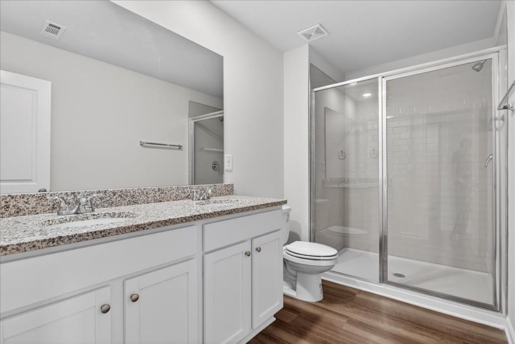 107 Brexley Drive Calhoun, GA 30701 - Photo 25 of 36 a bathroom with a granite countertop sink toilet and shower