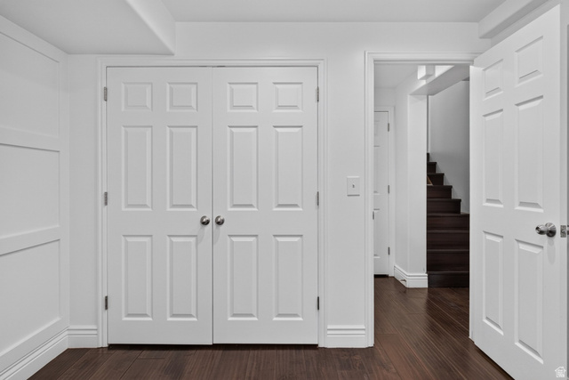 2223 North Pointe Meadow Loop Lehi, UT 84048 - Photo 35 of 56 Dark wood-finish flooring complements white walls with wainscoting and trim