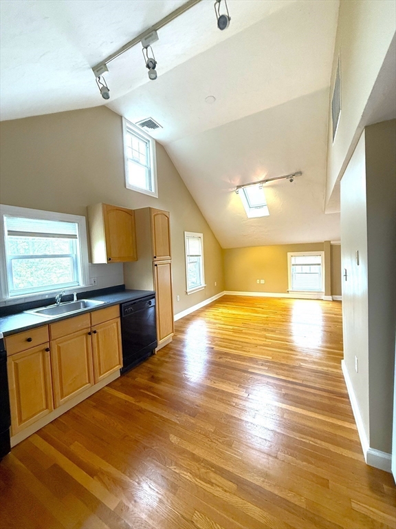 6 Skillings Road, Unit 2 Winchester, MA 01890 - Photo 3 of 8 a view of a kitchen with a sink and wooden floor
