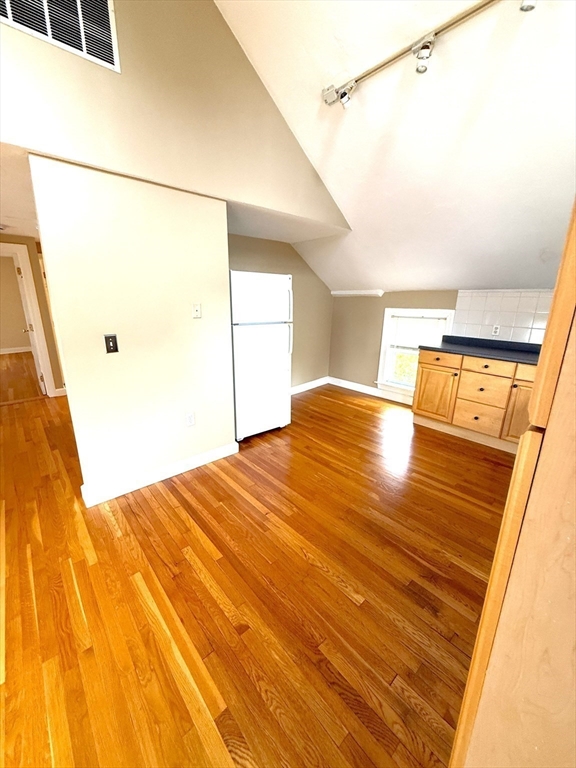 6 Skillings Road, Unit 2 Winchester, MA 01890 - Photo 4 of 8 a view of a room with a wooden floor