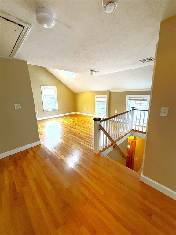 6 Skillings Road, Unit 2 Winchester, MA 01890 - Photo 5 of 8 a view of an empty room with wooden floor