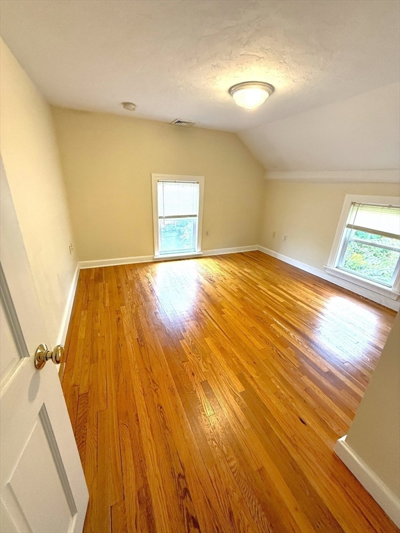 6 Skillings Road, Unit 2 Winchester, MA 01890 - Photo 7 of 8 a view of empty room and wooden floor