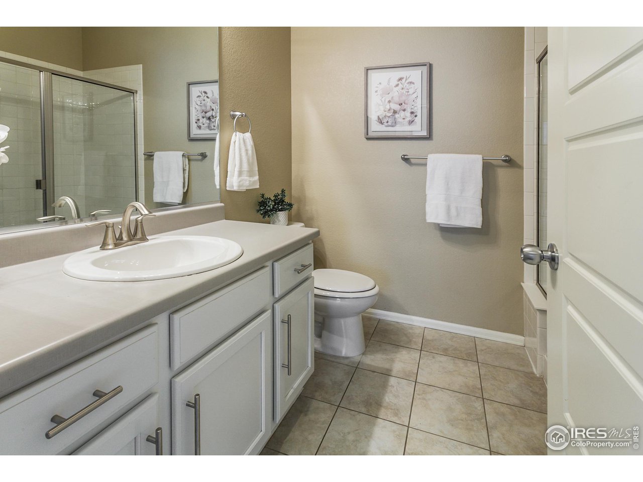 2002 Yearling Drive Fort Collins, CO 80525 - Photo 12 of 40 a bathroom with a sink and a mirror