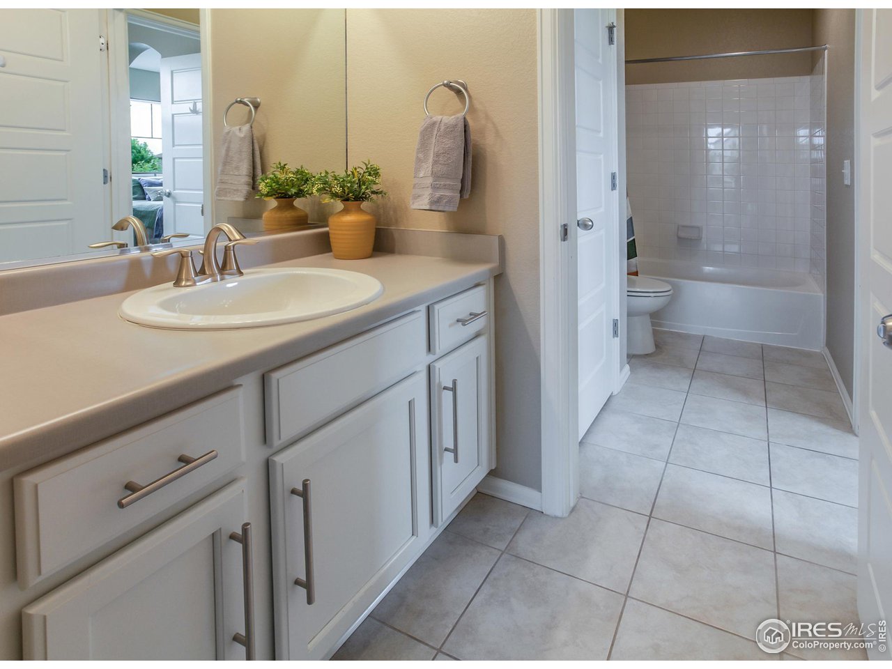 2002 Yearling Drive Fort Collins, CO 80525 - Photo 20 of 40 a bathroom with a sink a toilet and shower