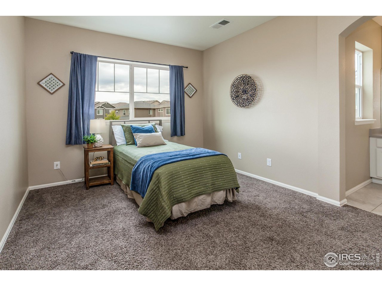 2002 Yearling Drive Fort Collins, CO 80525 - Photo 23 of 40 a bedroom with a bed and a window