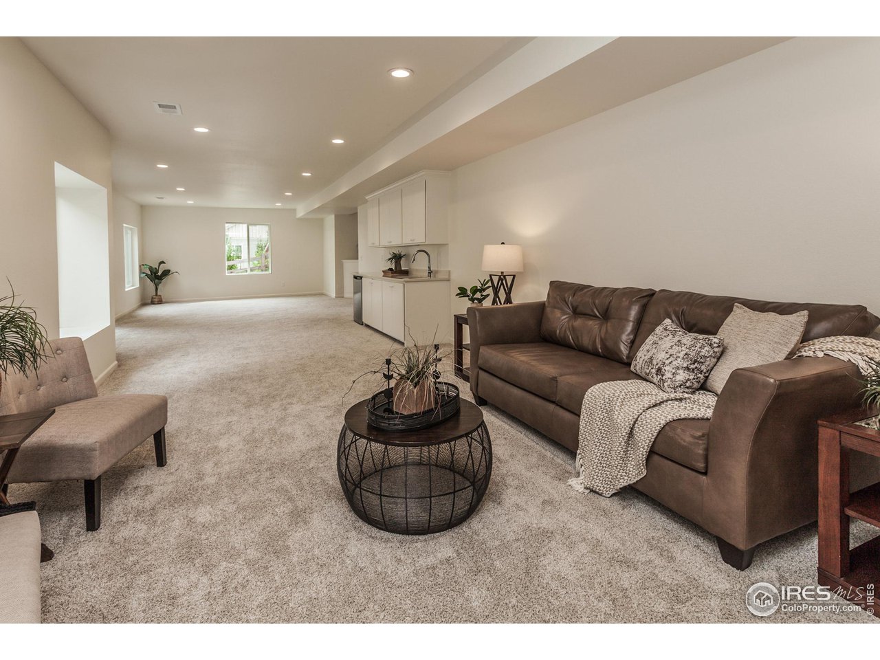 2002 Yearling Drive Fort Collins, CO 80525 - Photo 27 of 40 a living room with furniture a couch and a coffee table