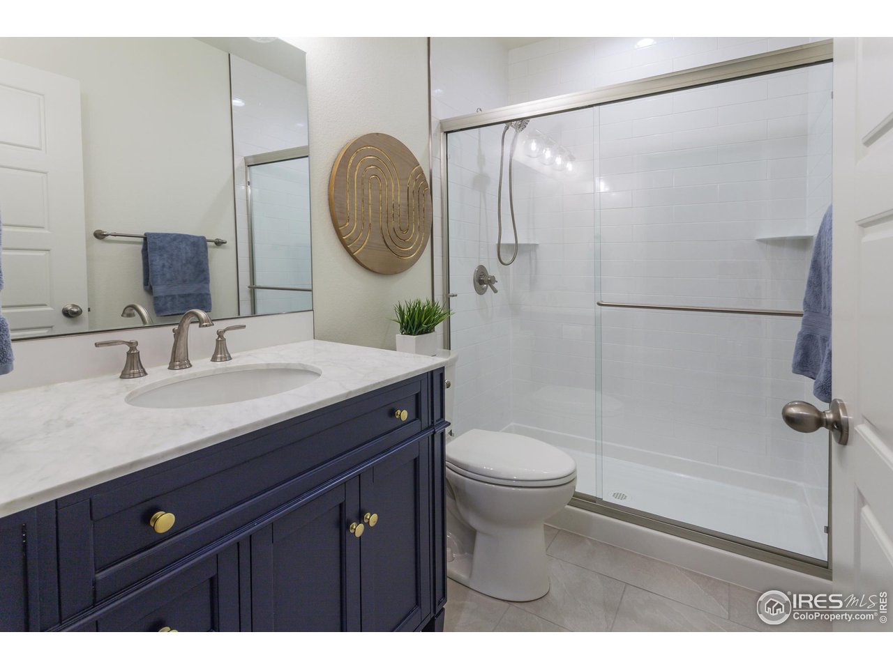 2002 Yearling Drive Fort Collins, CO 80525 - Photo 29 of 40 a bathroom with a sink a toilet and a mirror