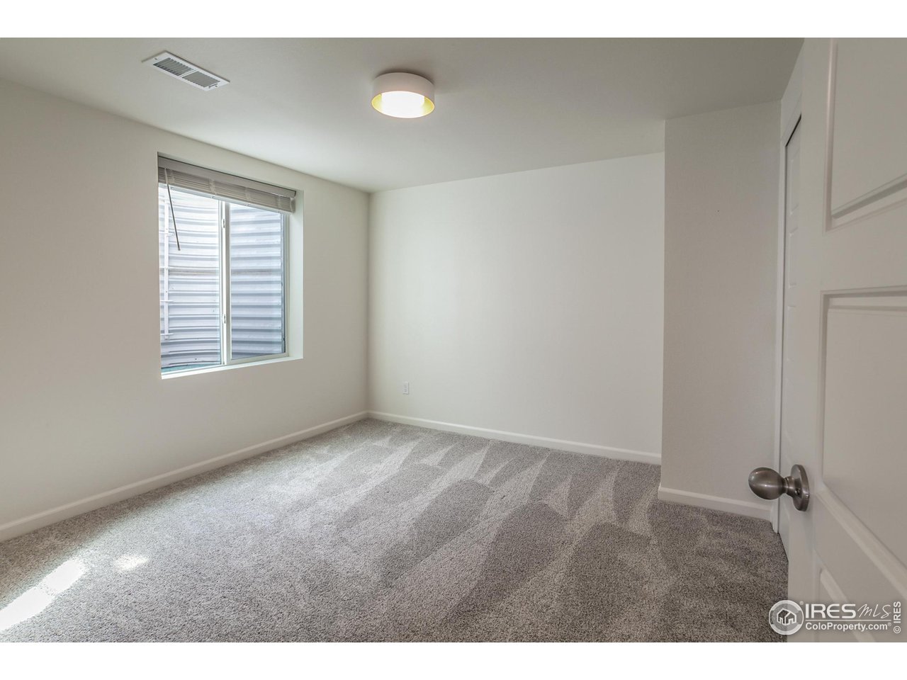 2002 Yearling Drive Fort Collins, CO 80525 - Photo 30 of 40 a view of an empty room with a window