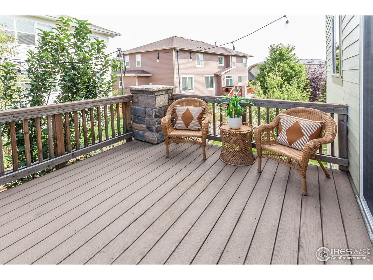 2002 Yearling Drive Fort Collins, CO 80525 - Photo 34 of 40 a balcony with wooden floor table and chairs