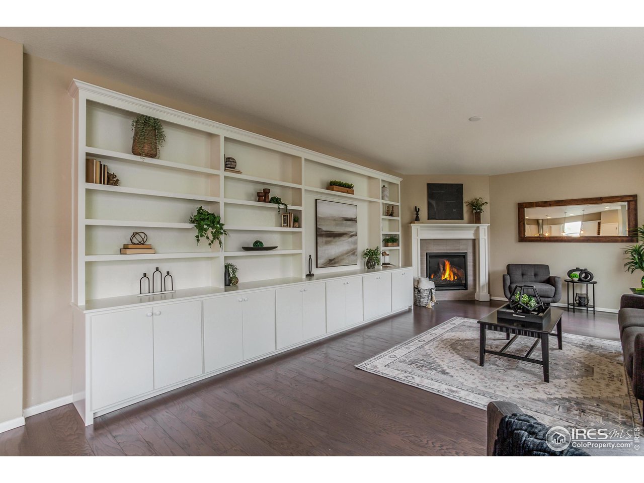 2002 Yearling Drive Fort Collins, CO 80525 - Photo 5 of 40 a living room with furniture a fireplace and a flat screen tv