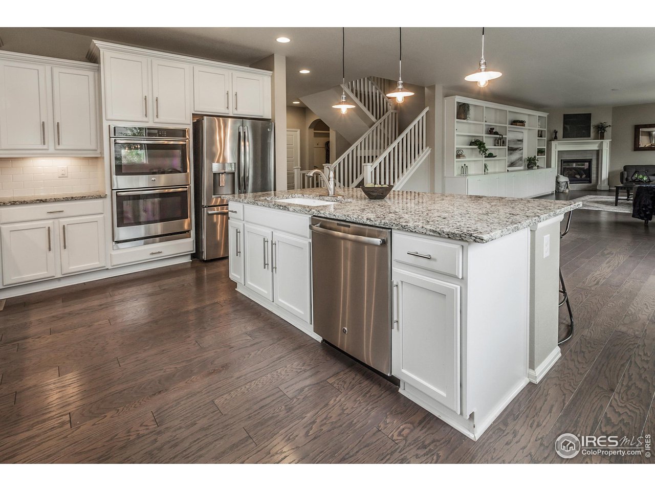 2002 Yearling Drive Fort Collins, CO 80525 - Photo 10 of 40 a kitchen with stainless steel appliances granite countertop a sink refrigerator and cabinets