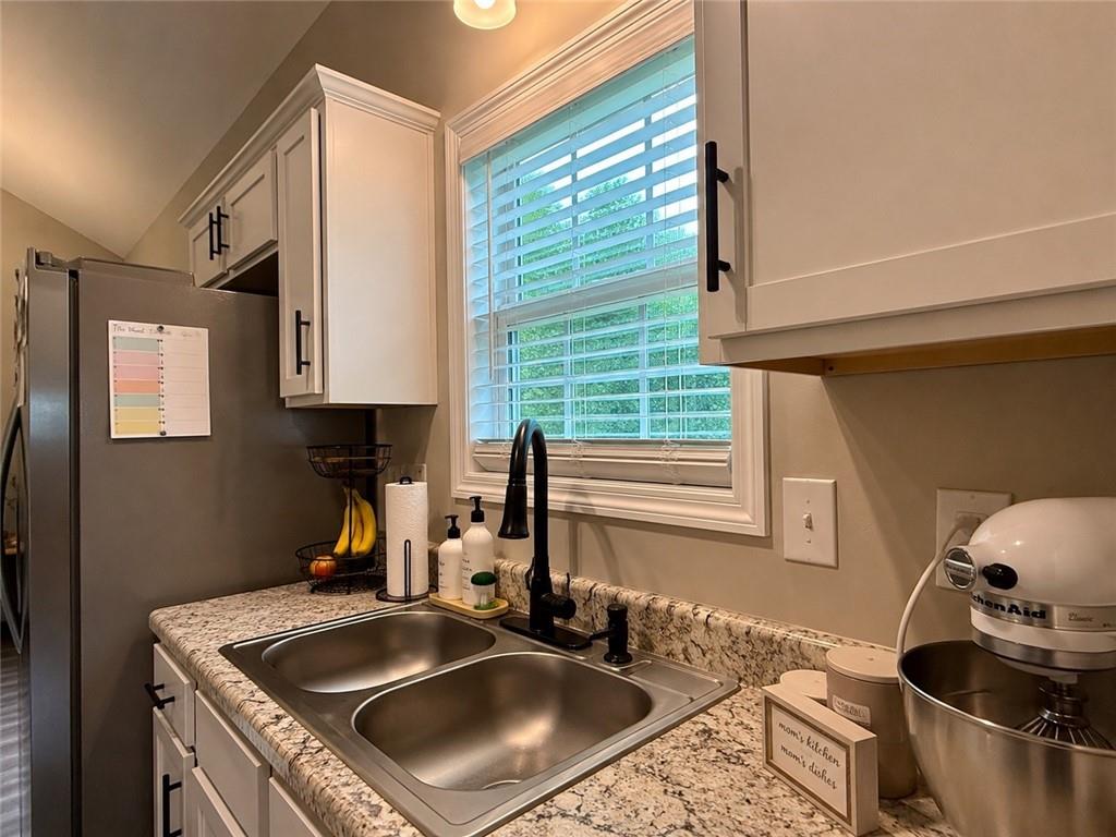 1776 Pleasant Grove Road Temple, GA 30179 - Photo 13 of 45 a kitchen with a sink stove and cabinets