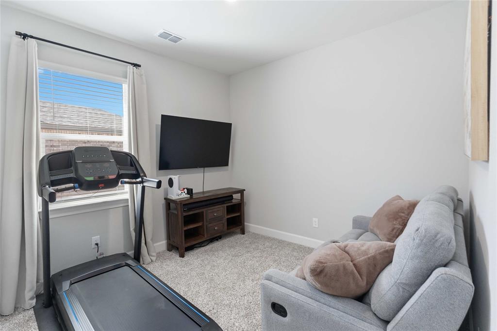1012 Calhoun Drive Anna, TX 75409 - Photo 22 of 39 Carpeted room featuring a window with blinds and drapes, recessed lighting, and a neutral wall color