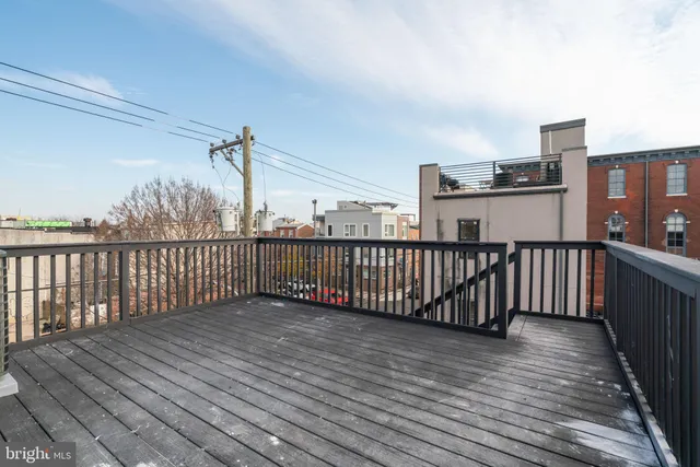 a view of a balcony with wooden floor