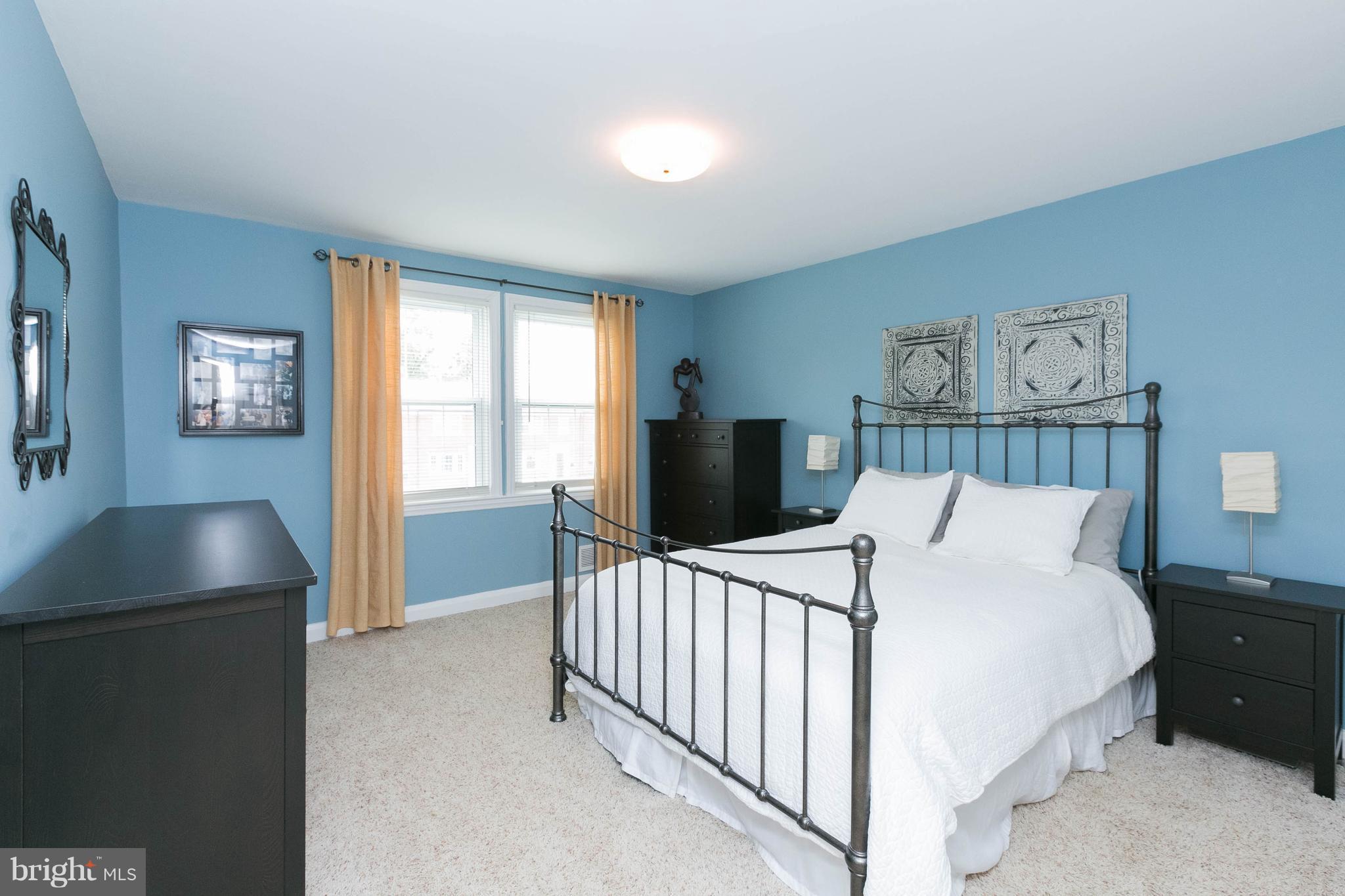 344 Greenlow Road Baltimore, MD 21228 - Photo 14 of 27 a bedroom with a bed and a window