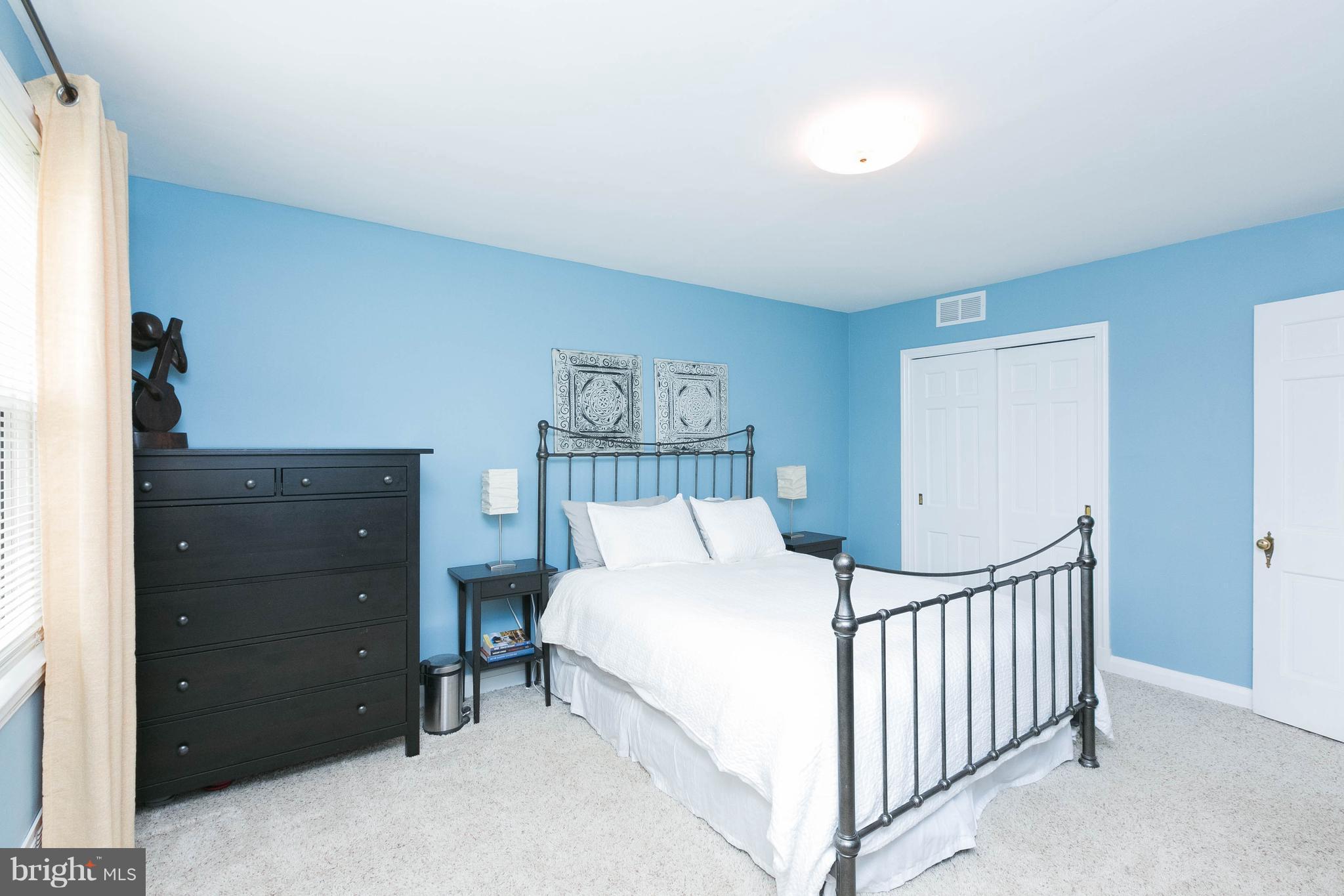 344 Greenlow Road Baltimore, MD 21228 - Photo 15 of 27 a bedroom with a bed and a window