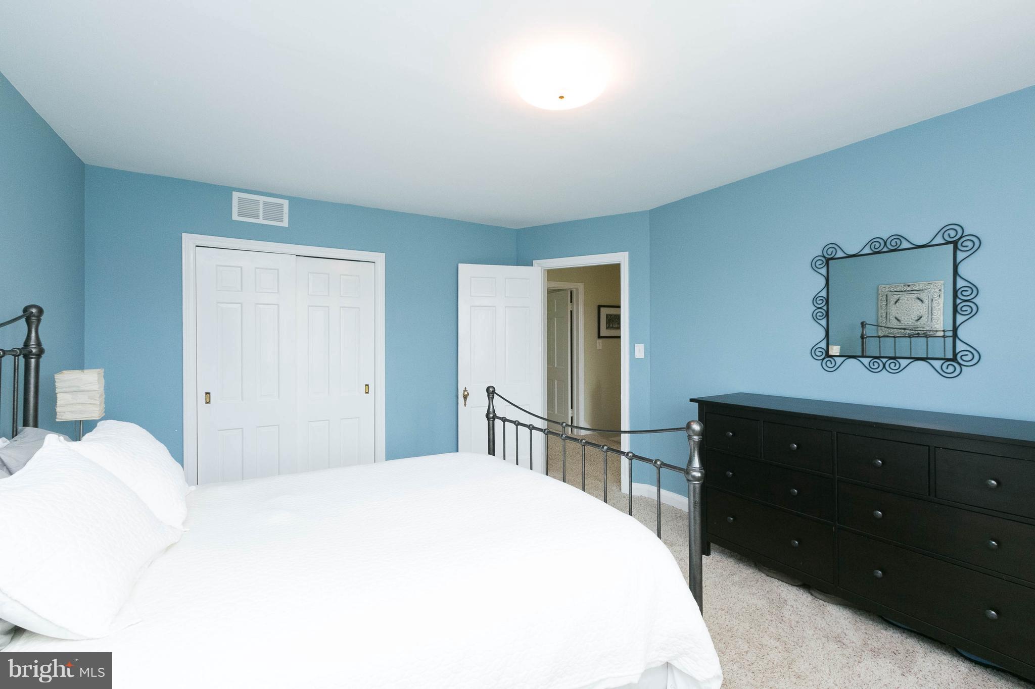 344 Greenlow Road Baltimore, MD 21228 - Photo 16 of 27 a bedroom with a bed and a dresser