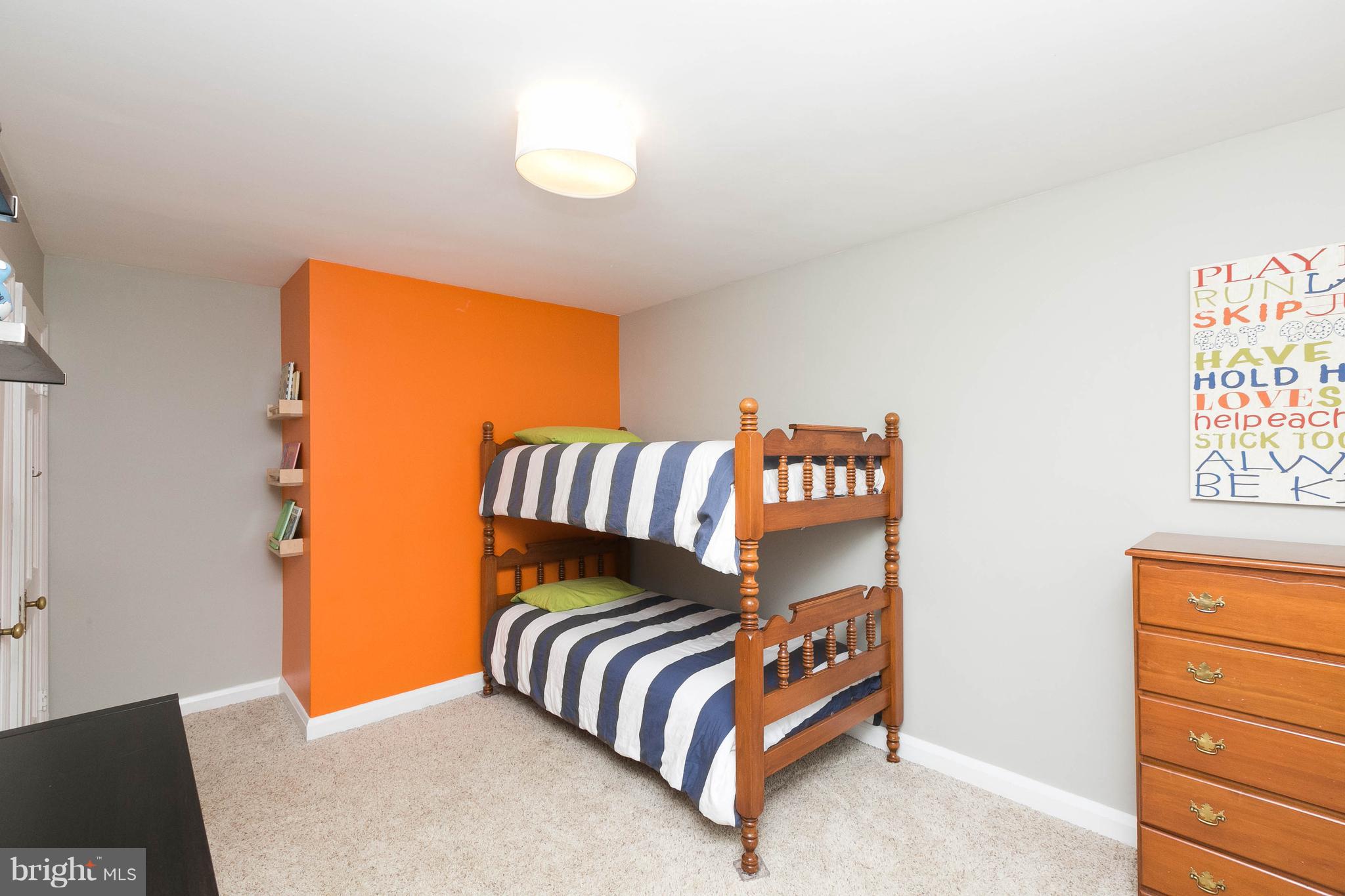 344 Greenlow Road Baltimore, MD 21228 - Photo 19 of 27 a bedroom with a bed and a painting on the wall