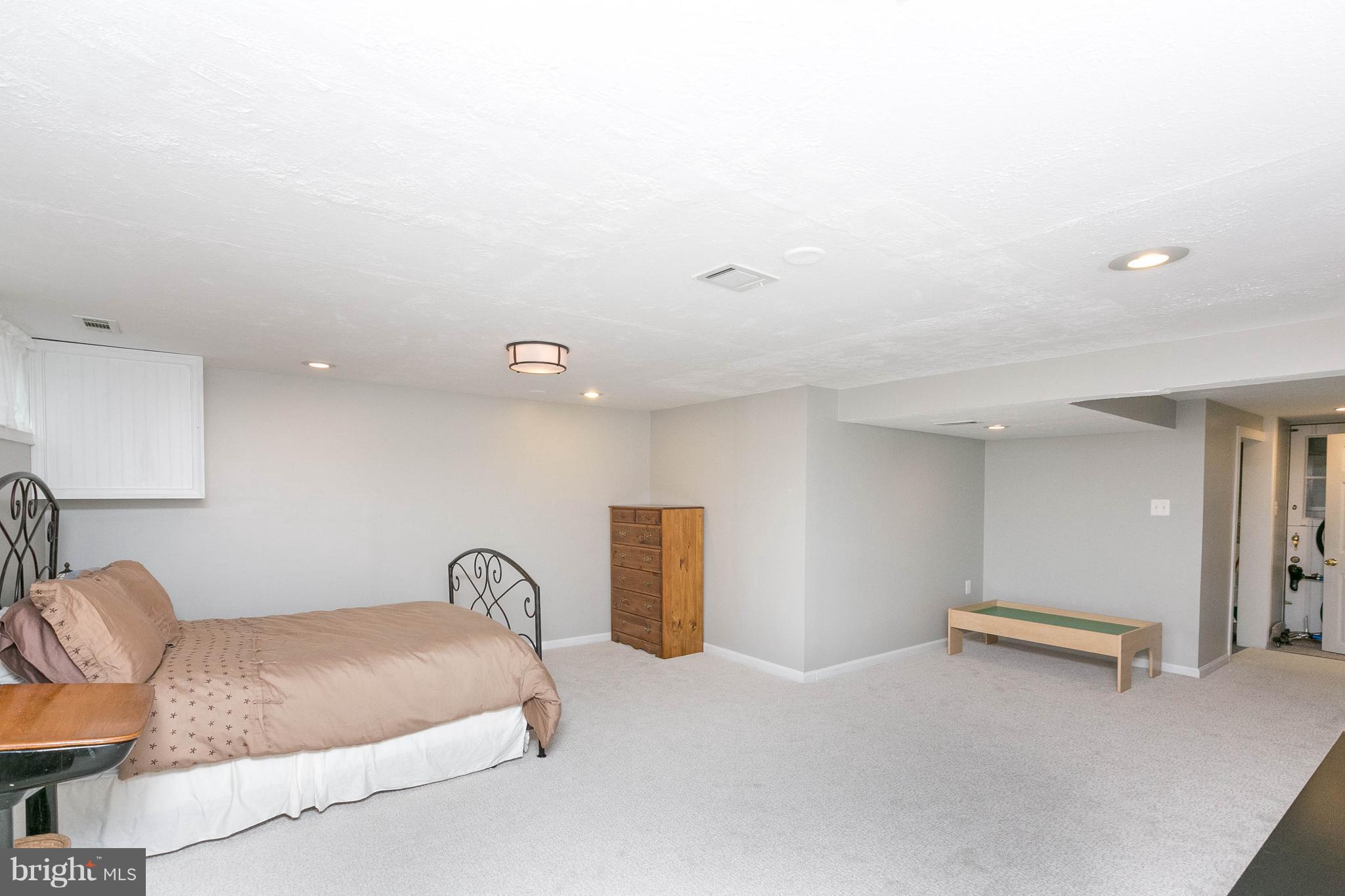 344 Greenlow Road Baltimore, MD 21228 - Photo 22 of 27 a bedroom with a bed and a couch