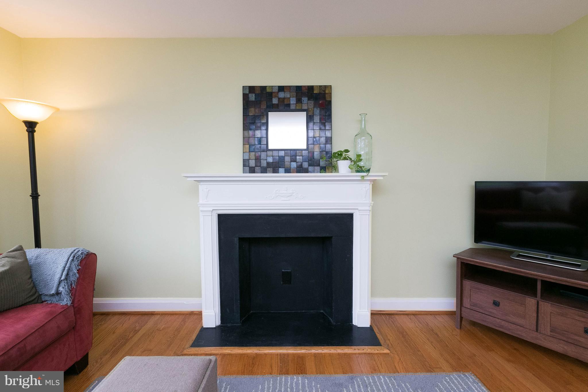 344 Greenlow Road Baltimore, MD 21228 - Photo 4 of 27 a living room with furniture and a fireplace
