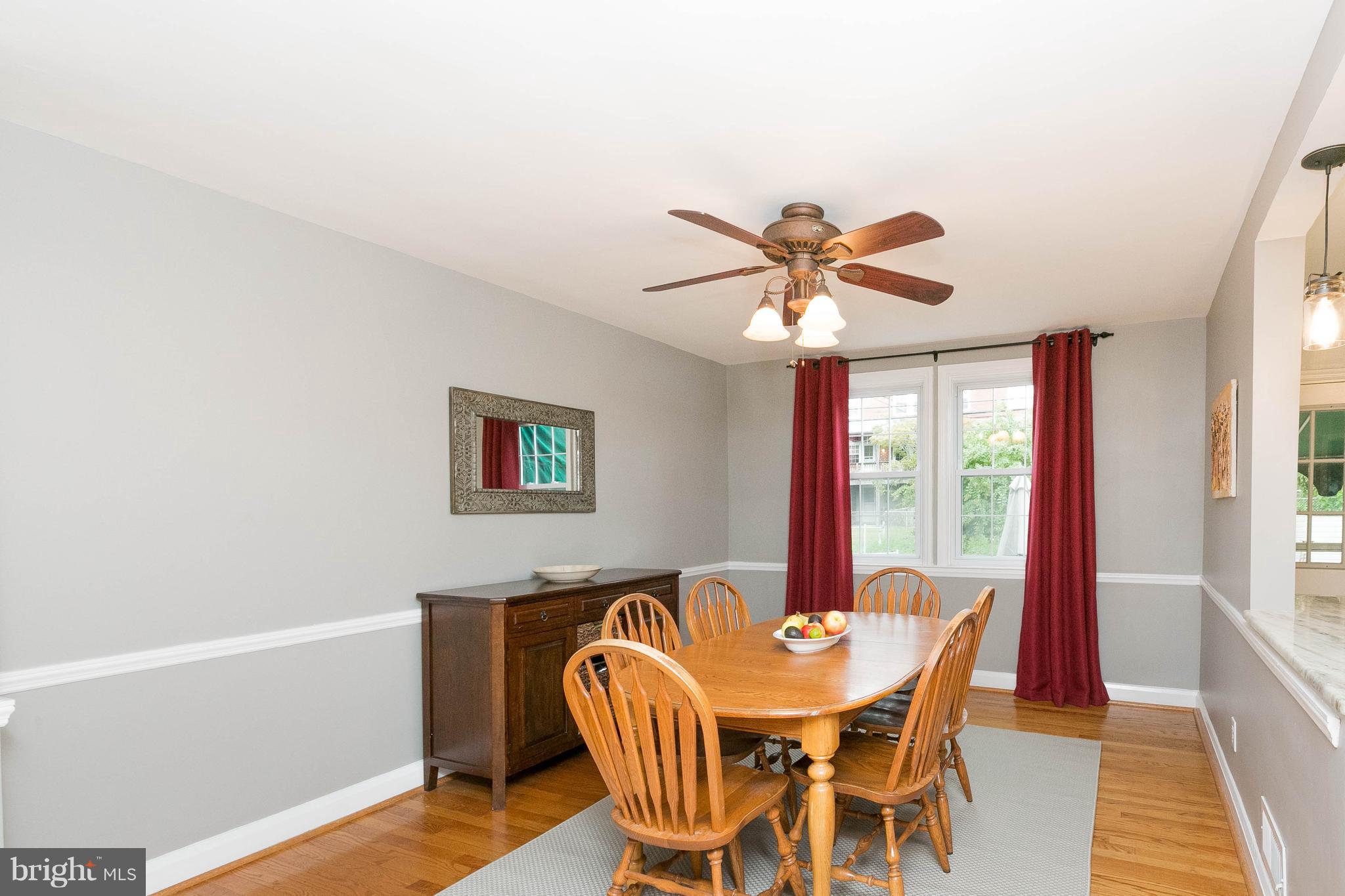 344 Greenlow Road Baltimore, MD 21228 - Photo 8 of 27 a view of a dining room with furniture window and wooden floor