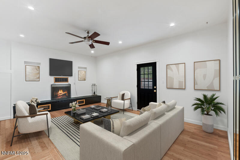 850 West 11th Street Reno, NV 89503 - Photo 11 of 31 a living room with furniture fireplace and a flat screen tv