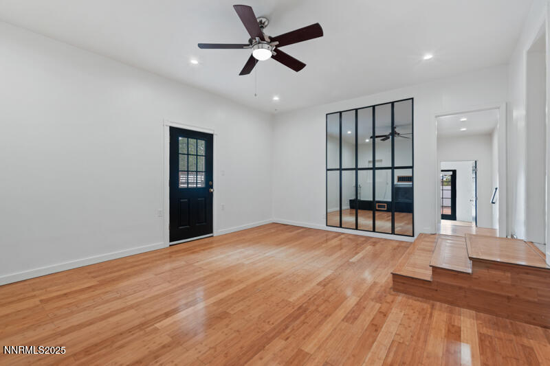 850 West 11th Street Reno, NV 89503 - Photo 12 of 31 a view of an empty room with wooden floor and a ceiling fan