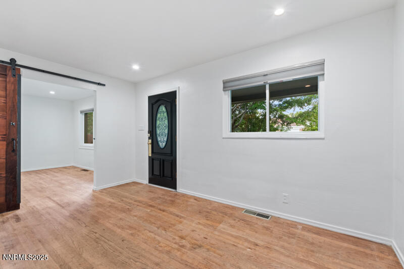 850 West 11th Street Reno, NV 89503 - Photo 3 of 31 a view of an empty room with wooden floor and a window
