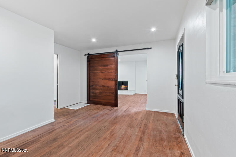 850 West 11th Street Reno, NV 89503 - Photo 4 of 31 wooden floor in an empty room with a hallway