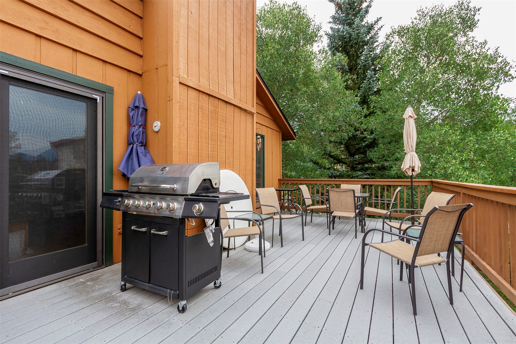857 Deer Path Road Dillon, CO 80435 - Photo 13 of 29 a view of a roof deck with table and chairs with wooden floor and fence