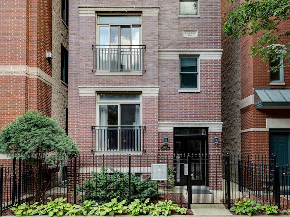 1347 West Fillmore Street, Unit A1 Chicago, IL 60607 - Photo 1 of 21 front view of a brick house with large windows