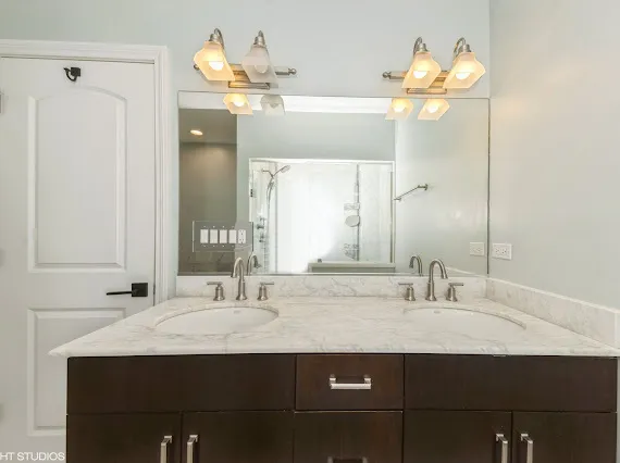 a bathroom with a sink and a mirror