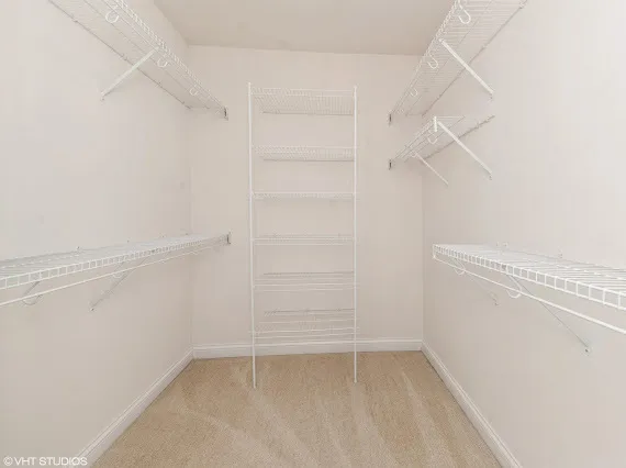 a view of an empty walk in closet