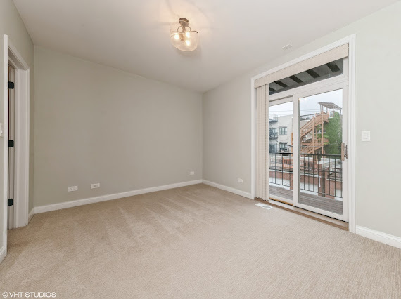 1347 West Fillmore Street, Unit A1 Chicago, IL 60607 - Photo 17 of 21 an empty room with windows