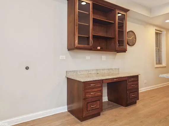 a room with a cabinets and a window
