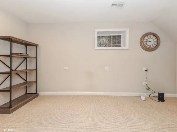 a view of a room with a fan and a window