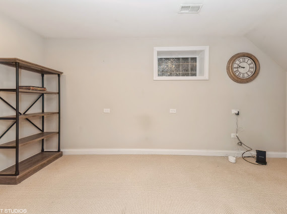 1347 West Fillmore Street, Unit A1 Chicago, IL 60607 - Photo 19 of 21 a view of a room with a fan and a window