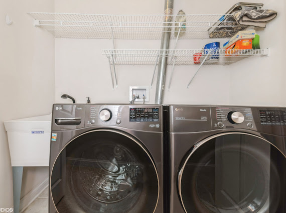 1347 West Fillmore Street, Unit A1 Chicago, IL 60607 - Photo 21 of 21 a utility room with dryer and washer