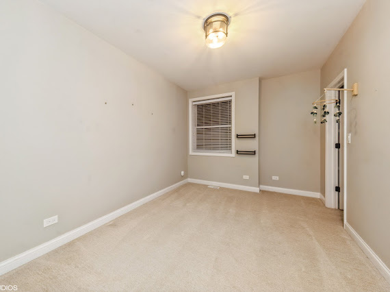 1347 West Fillmore Street, Unit A1 Chicago, IL 60607 - Photo 10 of 21 an empty room with windows and closet