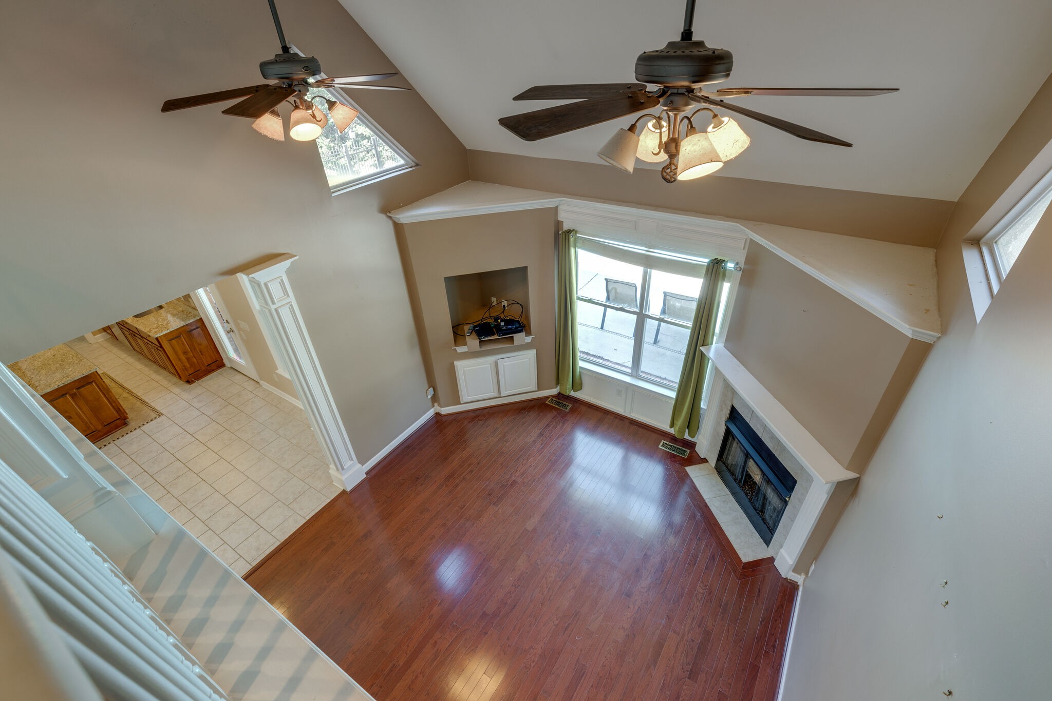 2017 Viewpointe Way Columbia, TN 38401 - Photo 20 of 24 a view of a livingroom with wooden floor and a ceiling fan