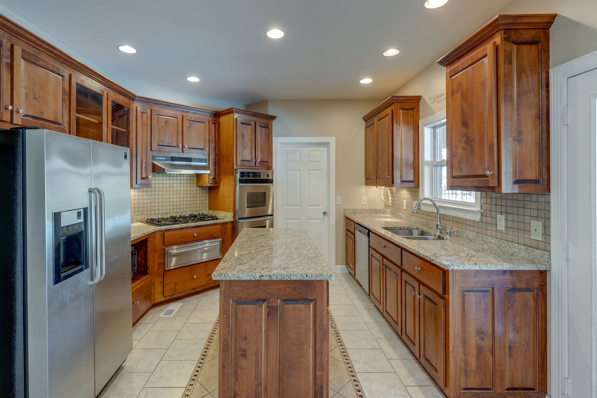 2017 Viewpointe Way Columbia, TN 38401 - Photo 7 of 24 a kitchen with stainless steel appliances granite countertop a refrigerator a stove and a sink