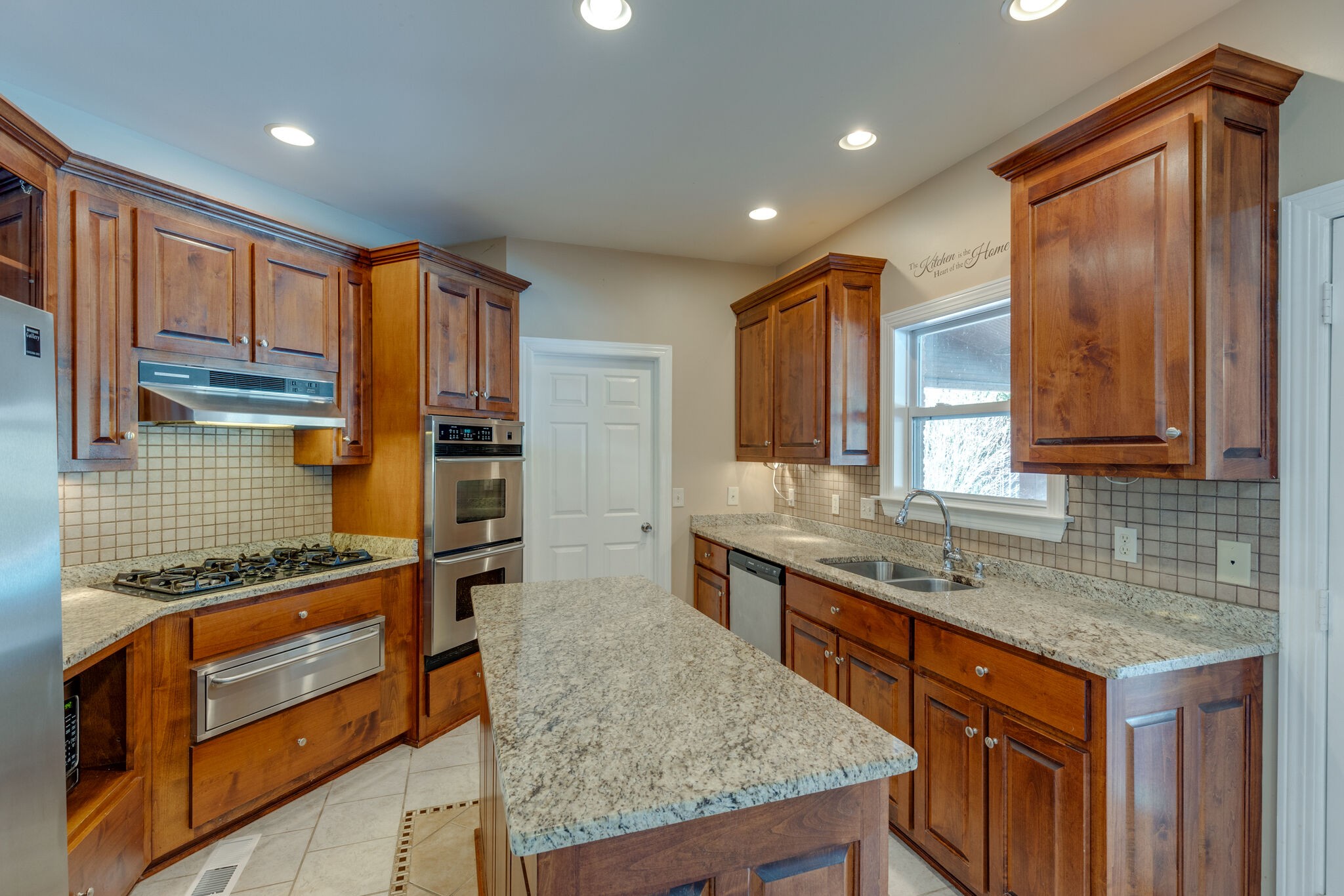 2017 Viewpointe Way Columbia, TN 38401 - Photo 8 of 24 a kitchen with stainless steel appliances granite countertop a sink stove and cabinets