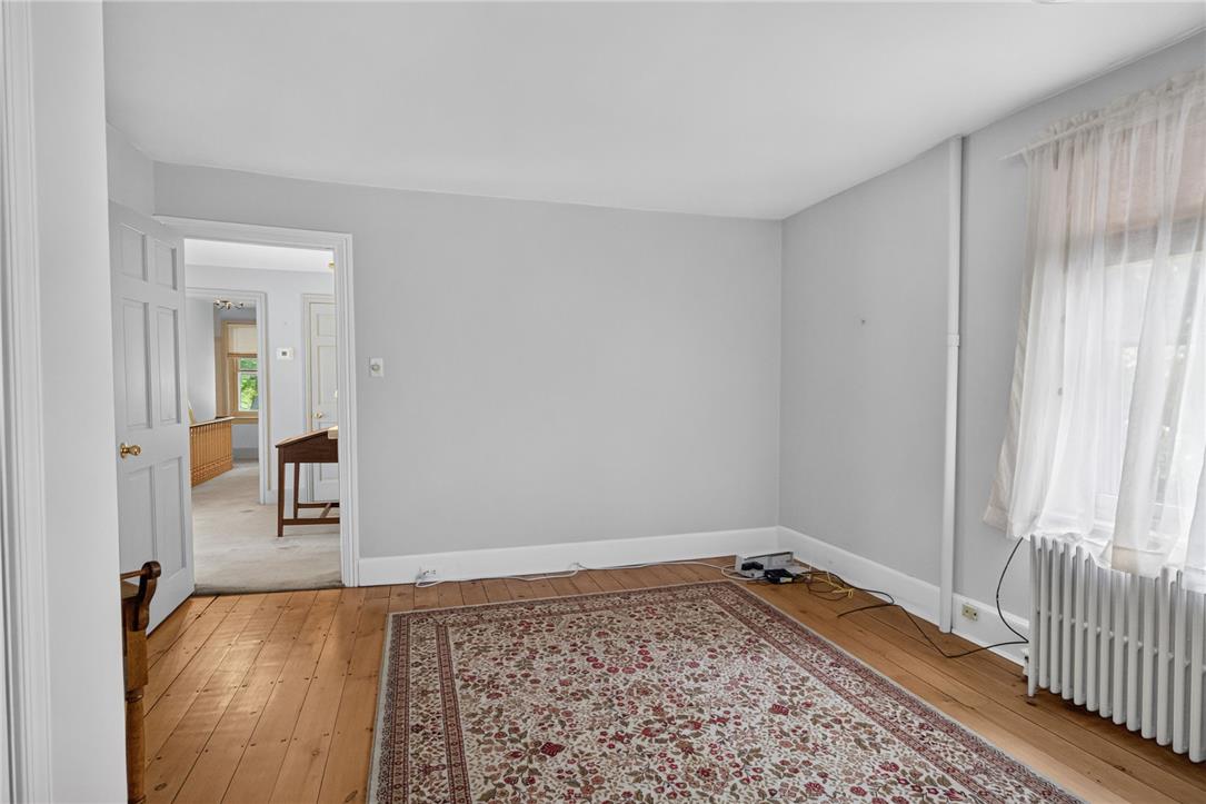 765 East Macada Road Bethlehem, PA 18017 - Photo 33 of 46 Hardwood floors stretch across this versatile room, offering an adaptable space for living.