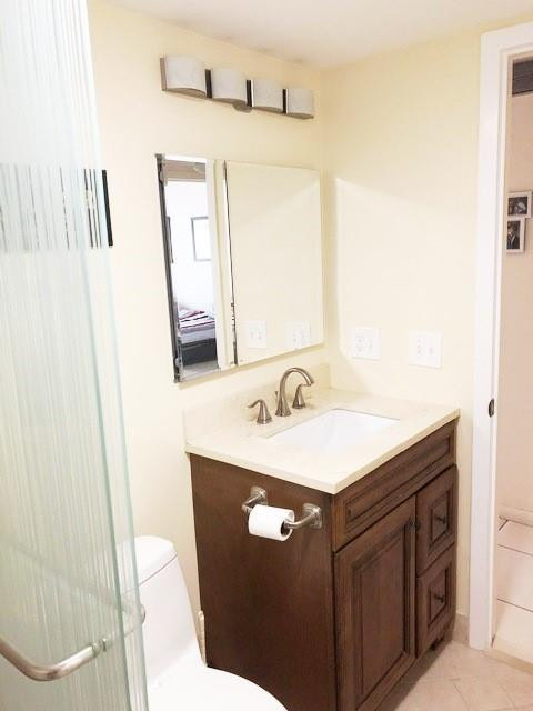 1057 Exeter, Unit 1057 Boca Raton, FL 33434 - Photo 31 of 64 Remodeled full bath with walk-in shower
