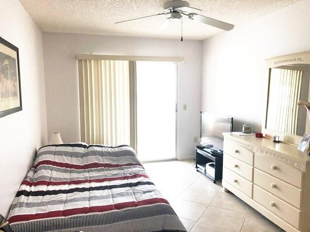 1057 Exeter, Unit 1057 Boca Raton, FL 33434 - Photo 34 of 64 Bedroom with sliders to patio