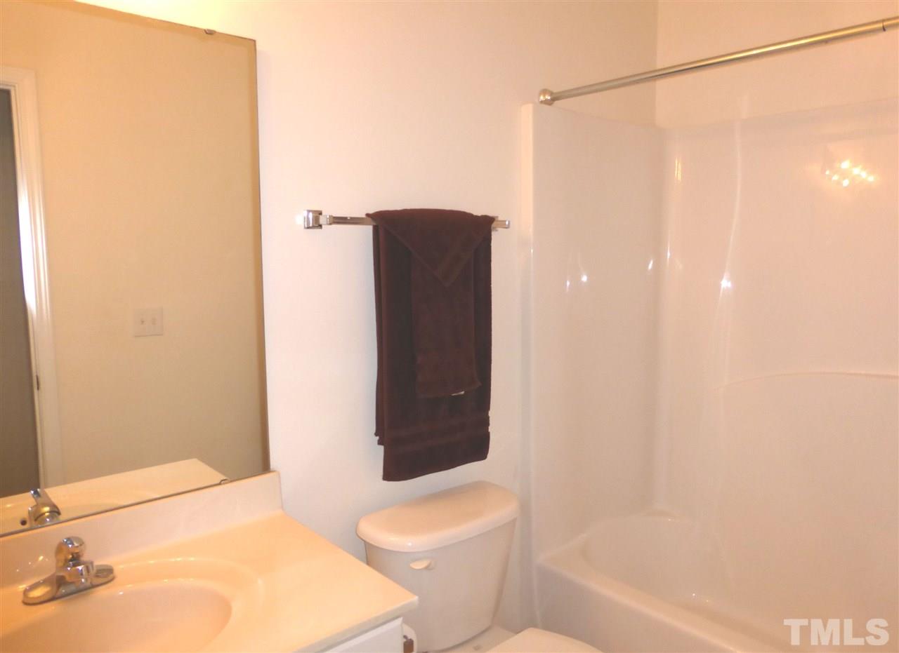 4205 Beacon Crest Way Raleigh, NC 27604 - Photo 14 of 20 a bathroom with a toilet and shower