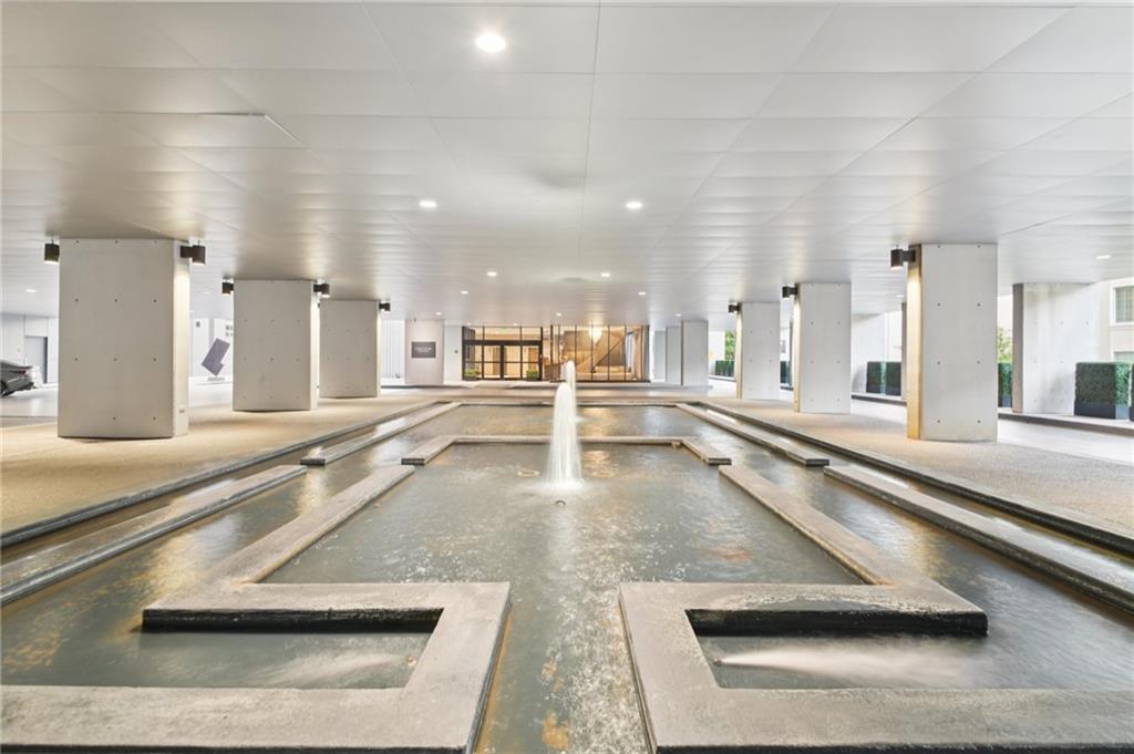 a view of a living room and kitchen