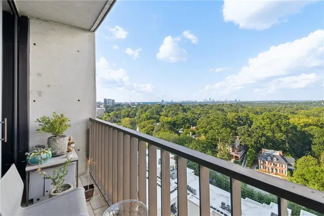 a balcony with wooden floor and lake view
