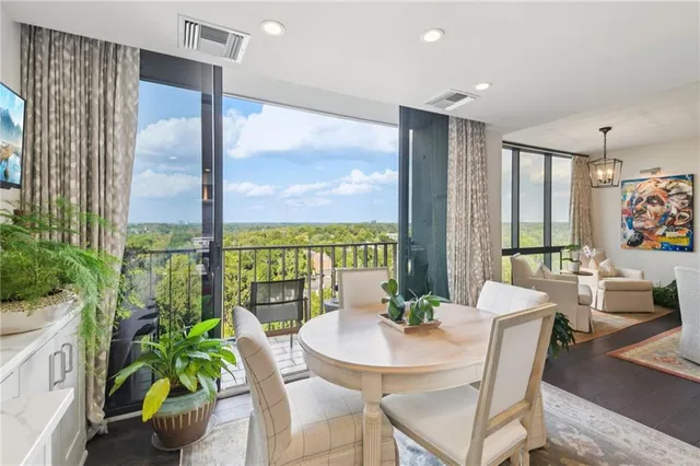 a view of a dining room with furniture window and outside view